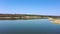 Picturesque lake. On the lake shore forest. Aerial view