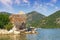 Picturesque lake and ruined fort on small island. View of Lake Skadar. Fortress Grmozur. Montenegro