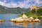 Picturesque lake with a ruined fort on a small island. View of Lake Skadar. Fortress Grmozur. Montenegro