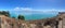 Picturesque landscape with bush, sea and mountains on background in a sunny day, Duder Regional Park, Auckland city, New Zealand