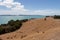 Picturesque landscape with bush, sea and mountains on background in a sunny day, Duder Regional Park, Auckland city, New Zealand