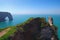 Picturesque landscape on the cliff of Etretat. la Manneporte natural rock arch wonder, cliff and beach