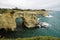 Picturesque landscape with cliffs, rocky arch and stacks faraglioni, at Torre Sant Andrea