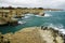 Picturesque landscape with cliffs, rocky arch and stacks faraglioni, at Torre Sant Andrea