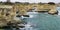 Picturesque landscape with cliffs, rocky arch and stacks faraglioni, at Torre Sant Andrea