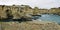 Picturesque landscape with cliffs, rocky arch and stacks faraglioni, at Torre Sant Andrea