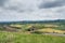 Picturesque Landscape of farm field with wind generator