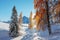 Picturesque landscape with orange larches covered by first snow