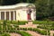 Picturesque landscape photo of the decorative architectural building called Echo colonnade and sculpture of Mercury the Roman God