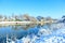 The picturesque landscape of the river snowy shore