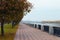 Picturesque landscape view of cobble stone pathway with autumn colored trees along the Dnieper River