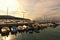 Picturesque landscape view of marine in Koper during sunset. Moored boats reflected on water