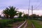 Picturesque landscape view of railroad in Glyfada. Scenic palm trees along the road