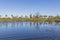 Picturesque landscape, waters of the Oude Maas river in Molenplas, windmill in the background