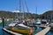 Picturesque marina with boats on moorings and still, calm, water