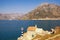 Picturesque Mediterranean landscape on sunny spring day. Montenegro. View of Bay of Kotor and ancient Church of Our Lady of Angels