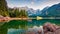 Picturesque morning view of Julian Alps. Splendid sunrise on Fusine lake. Majestic outdoor scene with Mangart peak on background,