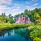 Picturesque morning view of Plitvice National Park. Colorful spring scene of green forest with pure water waterfall. Great