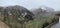 Picturesque mountain landscape of a panorama of Trento, Italy, huge valley, snow-covered mountain, fog, snowing