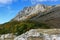 Picturesque mountain rocky peak and surrounding mountain landscape on a sunny autumn day.