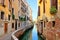 Picturesque narrow canal in Venice, Italy