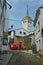 Picturesque, Narrow, Curved And Uphill Streets In Castropol With The Capanary Of The Church Of Santiago Apostol In The Background.