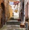 Picturesque narrow street in ancient medieval hills town of Montepulciano, Tuscany, Italy.