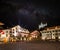Picturesque nightscape of illuminated buildings and castle of Thun, Switzerland under starry sky