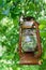 Picturesque oil lantern hanging in an apple tree