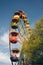 Picturesque old Ferris wheel against a clear blue sky. Children`s holiday