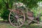 Picturesque old wooden ancient cart decorated with flower for a wedding