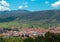 Picturesque panorama of Starigrad town on the island of Hvar. Seen from a nearby hill. Old church belltower rising above the