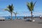 Picturesque Playa JardÃ­n beach on the Spanish Canary Island Tenerife with black volcanic sand blue ocean water and green palm