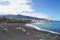 Picturesque Playa JardÃ­n beach on the Spanish Canary Island Tenerife with black volcanic sand blue ocean water and green palm