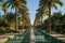 A picturesque pool surrounded by lush palm trees in a tranquil garden setting, A peaceful oasis surrounded by date palms,