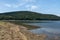 Picturesque Rabisha lake with authentic shore, bivouac and mountain over Magura cave