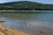 Picturesque Rabisha lake with authentic shore, bivouac and mountain over Magura cave