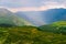 Picturesque rainbow in the mountains. Amazing mountains valley scenic view after the rain. Altai mountains