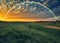 picturesque rainbow over the river. tourist enjoys colorful sunrise