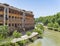 A picturesque residential building on Tiber island with the river flowing.