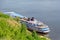 Picturesque river landscape. Four-deck cruise ship at the pier. The view from the top. Volga River, Russia, Tatarstan