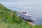 Picturesque river landscape. Four-deck cruise ship at the pier. The view from the top. Volga River, Russia, Tatarstan