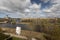 a picturesque river in Narva city with a towering clock tower in  Estonia