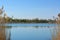 Picturesque russian landscape. View of the lake with clear blue water between the thickets of dry reeds