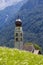 Picturesque San Valentino Church in Castelrotto village, surrounded by alpine mountain scenery