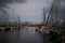 Picturesque scene of an array of moored boats as the ominous sky looms overhead