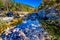 A Picturesque Scene with Fall Foliage on a Babbling Brook and Large Boulders at Lost Maples