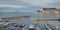 Picturesque scenery view to the calm Mediterranean Sea moored yachts in a row at harbour of Calpe, Costa Blanca, Spain