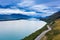 Picturesque scenic drive on winding road from Queenstown to Glenorchy by the Lake Wakatipu on a sunny day