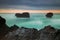 Picturesque seascape. Amazing landscape. Rock in the ocean. Motion waves. Silky water. Long exposure image. Soft focus. Concept of